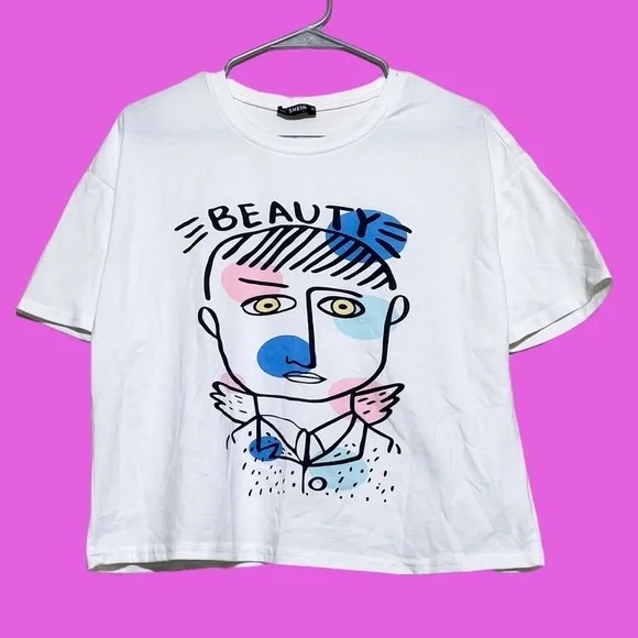 SHEIN Tops - White Graphic T-Shirt with Abstract Face Design